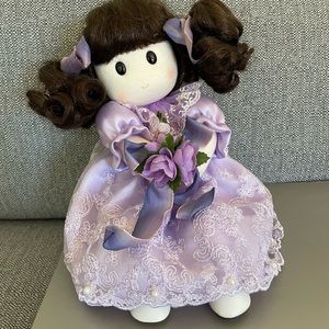 Doll in purple dress